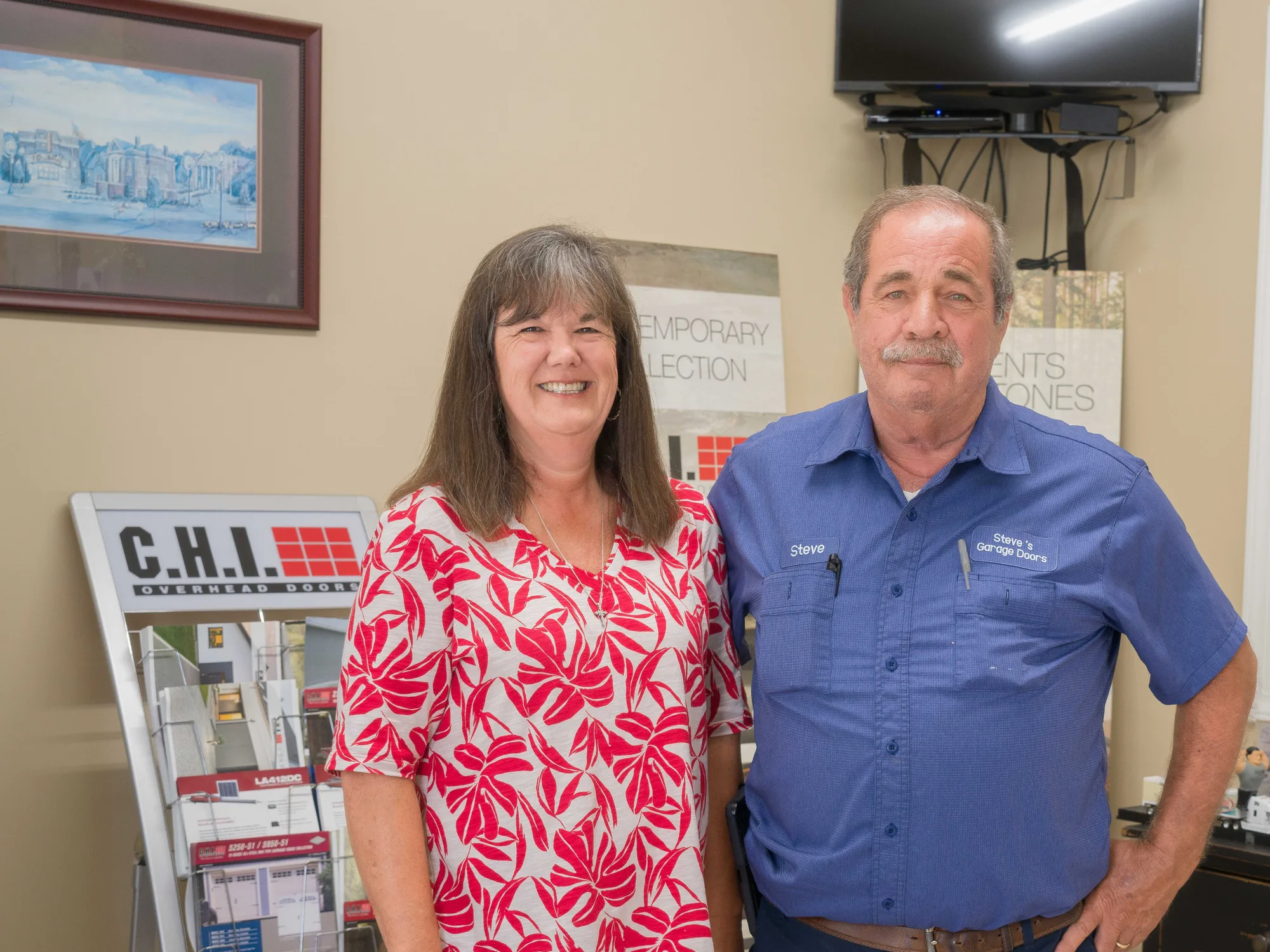 Steve and Loretta Dukes in the showroom at Steve's Garage Doors